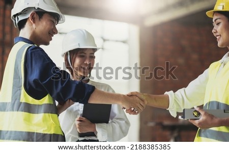 Male civil engineer or architect hand shake with contractor after discussing about designing of building styles and inspect progress of housing project at construction sites Worker work in real estate
