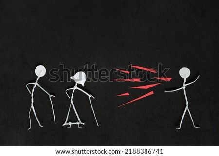 Seniors or old people verbal and emotional abuse concept. Stick man figure shouting or yelling on elderly couple stick figure in dark black background creative composition. Royalty-Free Stock Photo #2188386741