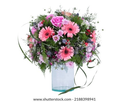 Flowers arranged in a bouquet set in a vase, on a white screen
