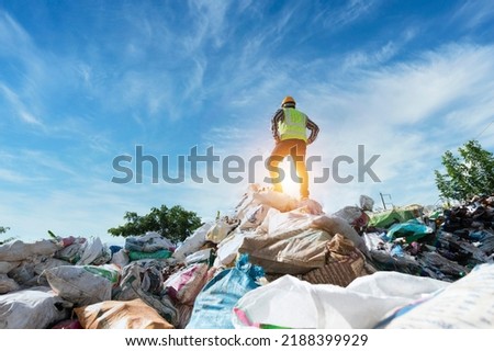 ecological engineering standing on the mountain rubbish big pile of garbage degraded waste A pile of bad smells and toxic residues. These wastes come from urban areas. industrial area Royalty-Free Stock Photo #2188399929