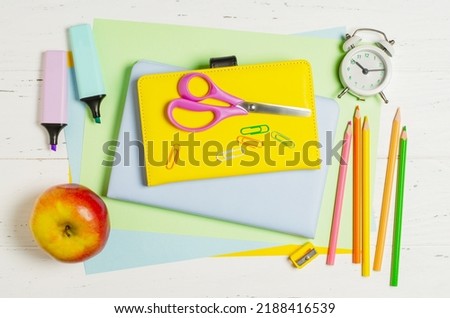 Children's accessories for study, creativity and office supplies on a white wooden background. Back to school concept