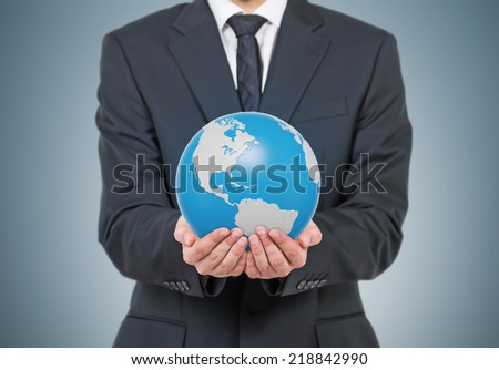 Businessman holding Earth globe, 3D rendering. Americas North and south view.  Elements of this image furnished by NASA