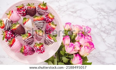 Flat lay. Step by step. Variety of chocolate dipped strawberries on a pink cake stand. Royalty-Free Stock Photo #2188495057