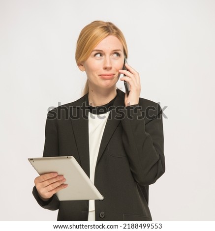 young woman in business clothes is using a tablet isolated