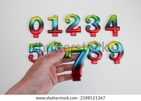 set of multi-colored numbers of candles from 1 to 9