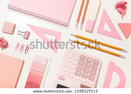school supplies in pink colors on a white background. Preparation for school. High quality photo