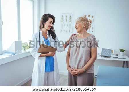 Smiling caring young female nurse doctor caretaker assisting happy senior grandma helping old patient in rehabilitation recovery at medical checkup visit, elder people healthcare homecare concept