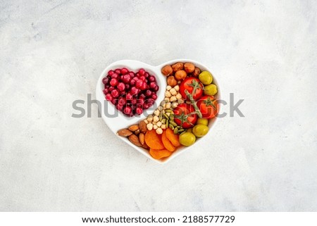 Healthy lifestyle and nutrition eating concept with food in heart shaped dish