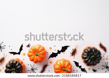 Halloween party decor concept. Top view photo of small pumpkins bat silhouettes creepy insects spiders cockroaches centipedes and confetti on isolated white background with blank space