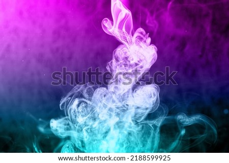 Photo of smoke on a dark background, close-up. Colored smoke