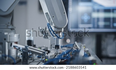 Industry 4.0 Modern Factory: Programmed Robot Arm Moving at Different Sides. Production Line Machine at Empty room.No people, Close Up View. Automated Robotics Concept