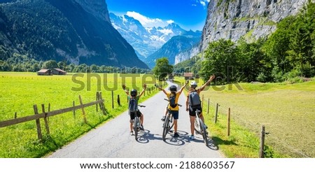 family on bike in Switzerland- Lauterbrunnen