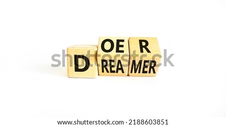 Doer or dreamer symbol. Concept words Doer or dreamer on wooden cubes. Beautiful white table white background. Business and doer or dreamer concept. Copy space. Royalty-Free Stock Photo #2188603851