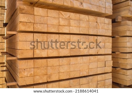 Processed blocks of timber ready for treating and re-processing. Timber products Royalty-Free Stock Photo #2188614041