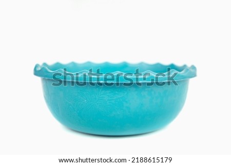 blue sky plastic basket which is usually used to place vegetables and fruit that have been cleaned isolated on a white background.