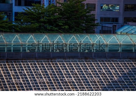 Roof pattern uses as background. The pattern of square on the roof is abstract art with sun light.