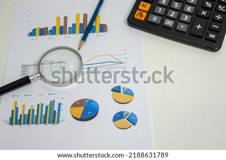 Business document graph management information marketing report and paperwork planning statistic finance concept.