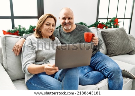 lovely couple together looking in the notbook 