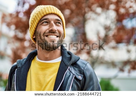 Handsome hispanic man with beard smiling happy outdoors Royalty-Free Stock Photo #2188644721