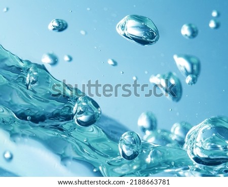 abstract water splash on blue background Royalty-Free Stock Photo #2188663781