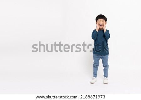 Asian little boy standing and open mouths raising hands screaming announcement isolated on white background, Full body composition and five years old Royalty-Free Stock Photo #2188671973