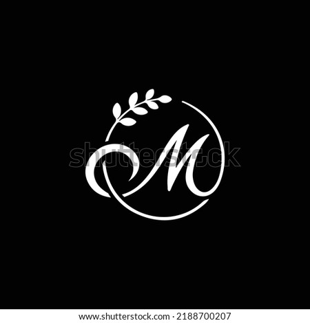 M Letter with leaf logo. Vector logo template letter m decorated with leaves