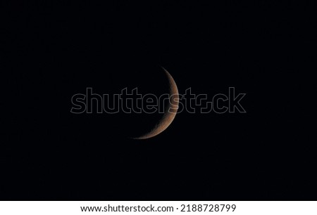 a close-up of the new moon at night Royalty-Free Stock Photo #2188728799