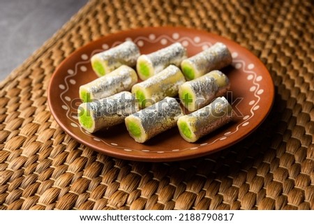 Kaju Pista Roll Or Cashew Pistachio Rolls Mithai or sigar, Indian sweet or dessert for festivals Royalty-Free Stock Photo #2188790817