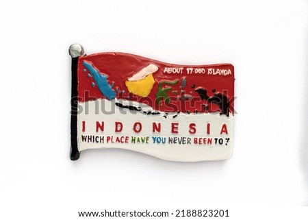 Colorful souvenir fridge magnet from Indonesia isolated on white background.