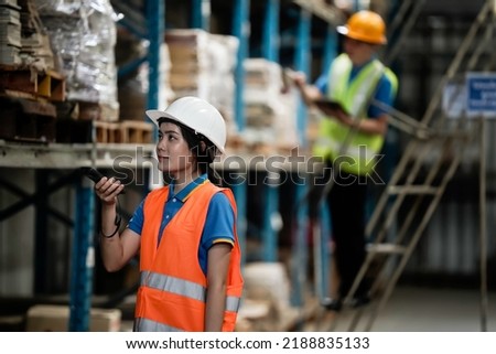 Warehouse workers selling stock checks with tablets and bar code launcher,business idea
