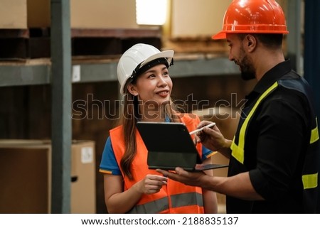 Asian salesman, check stock in warehouse with tablet, business idea