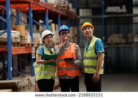 Warehouse workers selling stock checks with tablets,business idea