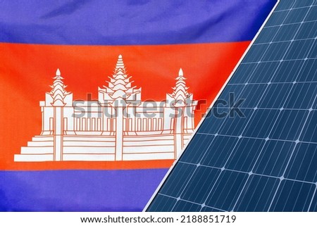 Solar panels against flag Cambodia background. Solar battery generates a pure electricity. Concept of sustainable resources and renewable energy in Cambodia
