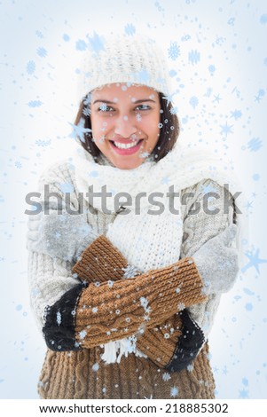 Pretty brunette in warm clothes against snow falling