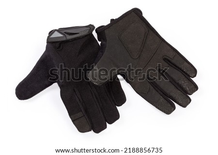Pair of the black tactical military gloves made with textile and synthetic leathern on a white background
 Royalty-Free Stock Photo #2188856735