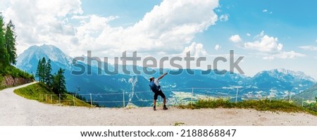 A Man is Hiking in the alps. cheering moving activity Dab. Jenner Mountain panorama - Berchtesgaden Alps, Bavaria, Germany, Schoenau am Koenigssee Royalty-Free Stock Photo #2188868847