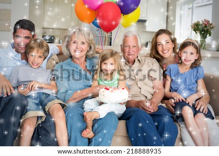 Composite image of Multigeneration family celebrating girls birthday against snow