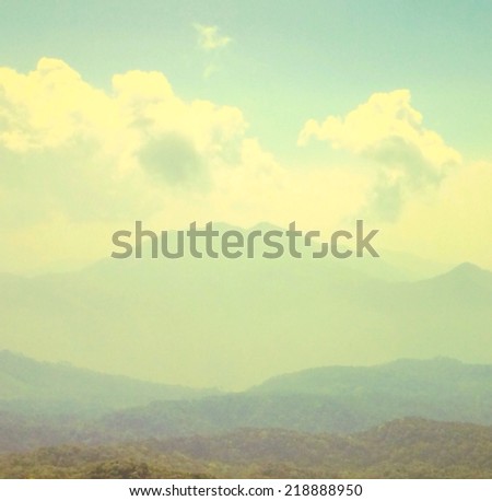 Landscape of Sky , cloud , tree and mountain with retro filter effect or instagram filter 
