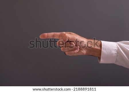 hands creating meanings on a gray background