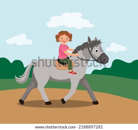 cute little girl riding a horse at the park
