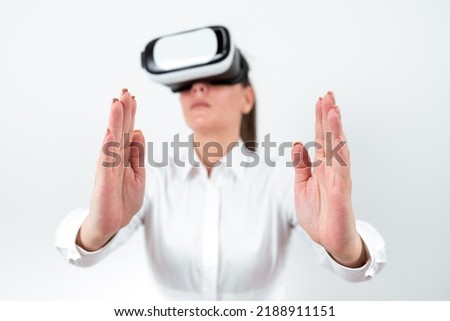 Woman Wearing Vr Glasses And Presenting Important Messages Between Hands. Businesswoman Having Virtual Reality Eyeglasses And Showing Crutial Informations.