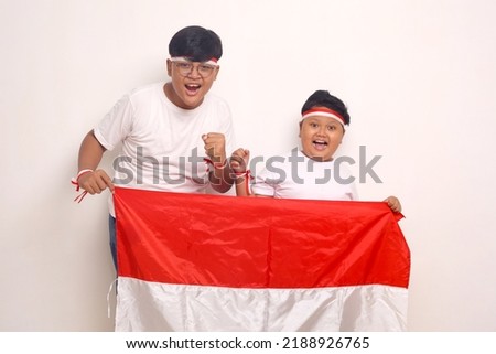 Indonesian kids celebrate independence day. Isolated on white background