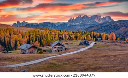 Great sunset on Fuchiade valley, Italy, Europe. Incredible evening view of Dolomite Alps, Italy, Europe. Spectacular autumn scene of Italian countryside. Traveling concept background. Royalty-Free Stock Photo #2188944079