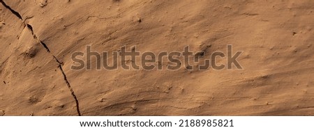 Wall of soil house. texture of clay house structure. Mud background, selective focus. soft picture	 Royalty-Free Stock Photo #2188985821