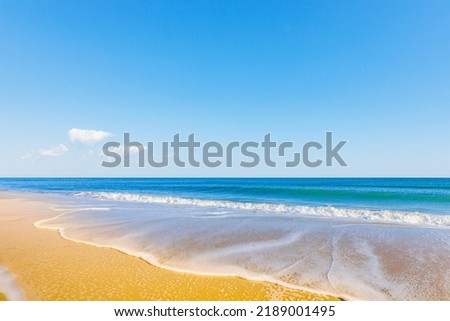 Water and wave on blue ocean beach