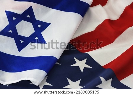 USA Israel. Photo American flag and Flag of Israel conveys the partnership between the two states through the main symbols of these countries Royalty-Free Stock Photo #2189005195