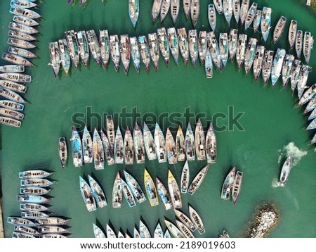 Traditional fishing boats park on the harbor in Prigi beach, Trenggalek Regency, East Java Province, Indonesia.