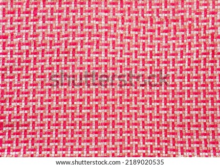 Seamless weave geometric pattern of red knitted threads. Bold hues for seasonal projects and basis designs. Close-up