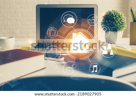 Desktop computer background in office and big town buildings hologram drawing. Double exposure. Smart city concept. Royalty-Free Stock Photo #2189027905