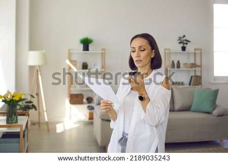 Woman recording audio voice message. Lady talking on speaker phone. Serious busy manager holding smartphone, using messenger app, giving order to employee, organizing day, making business